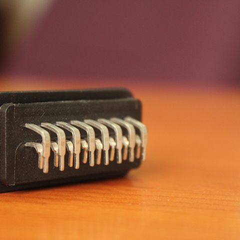 Insert molded plastic injection part